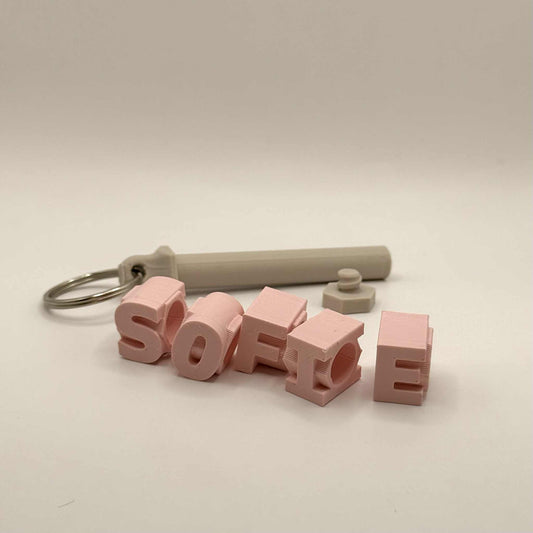 Nøkkelring med roterende bokstavklosser